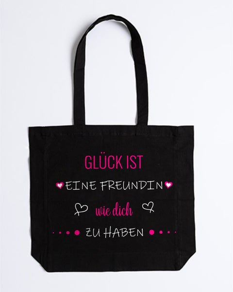 Stofftasche „Glück ist eine Freundin wie dich zu haben“ in Schwarz – „Glück ist“, „wie dich“ und Herzen in Pink