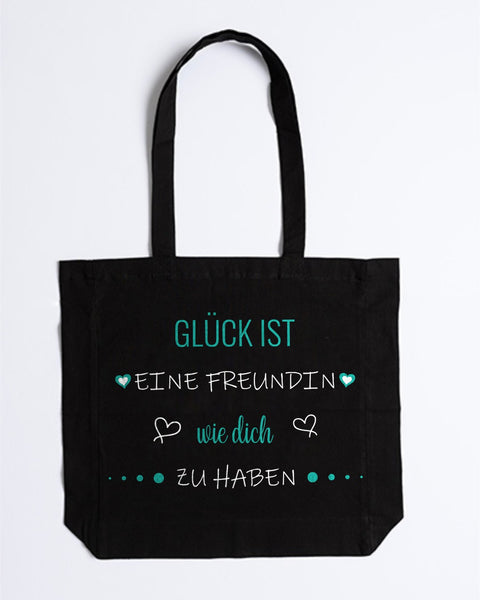 Stofftasche „Glück ist eine Freundin wie dich zu haben“ in Schwarz – „Glück ist“, „wie dich“ und Herzen in Türkis