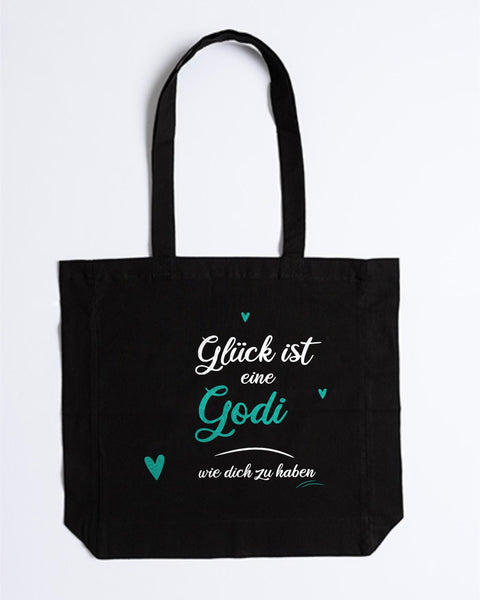 Stofftasche „Glück ist eine Godi wie dich zu haben“ in Schwarz – „Godi“ und Herzen in Türkis