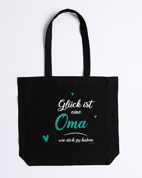 Stofftasche „Glück ist eine Oma wie dich zu haben“ in Schwarz – „Oma“ und Herzen in Türkis