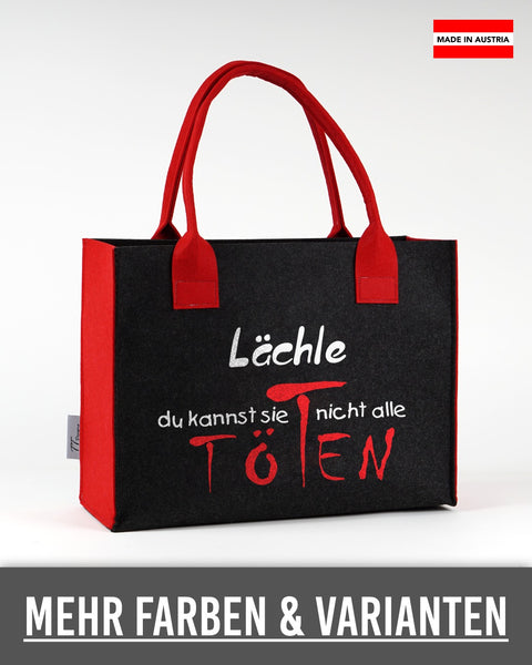 Filztasche „Lächle, du kannst sie nicht alle töten“ in Dunkelgrau mit roten Seiten und Henkeln