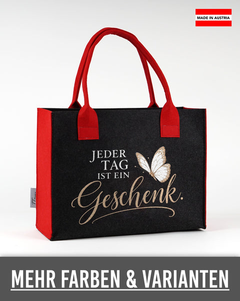 Filztasche „Jeder Tag ist ein Geschenk“ in Schwarz mit roten Seiten und Henkeln